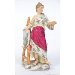 A 19th century Meissen type figurine of a female artist at an easel painting a country scene.