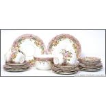 A Victorian chintz Staffordshire part tea service comprising cups, saucers,