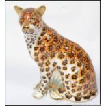 A Royal Crown Derby large paperweight Leopardess limited to 950 pieces with gold button.