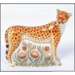 A Royal Crown Derby large paperweight Cheetah Mother limited to 950 pieces with gold stopper.