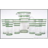 A stunning retro mid century lemonade set comprising green banded glasses and matching pitcher jug.