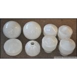 A set of 4 mid century white glass bolla