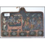 A tribal painting on wood of earthy pigm