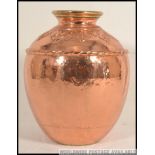 A very large 20th century heavy unusual hand beaten Arts and Crafts style copper / brass vase