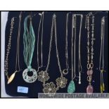 A tray of ten costume jewellery necklaces including white metal.