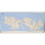 A large Wedgwood style wall plaque raised in relief with classical scenes 38x82cm