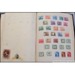 A vintage Amherst stamp album, filled with assorted overseas / foreign vintage stamps,