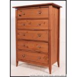 A contemporary beech wood upright pedestal chest of drawers.
