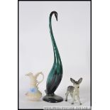 A Belleek Irish black mark jug with cream glaze together with a Beswick donkey and a swan figurine