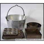 A vintage mid century preserve ( Jam ) pan along with several vintage cake tins to include to