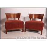 A pair of 1930's Art Deco style tub armchairs.