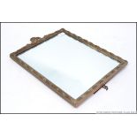 A good quality early century easel backed barbola mirror having gilt moulded frame with panel and