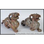 A striking pair of 19th century large sized Chinese oriental carved agate stone temple dogs.