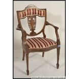 An Edwardian inlaid elbow chair, with central pierced splat, with scrolls and central lyre,