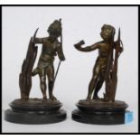 A pair of late 19th / early 20th century spelter bronzed figures on a marble base.