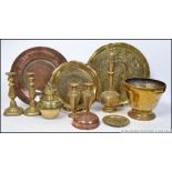 A collection of brasswares to include Edwardian candlesticks, Indian brass charger,