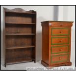 A vintage small oak open faced bookcase cabinet together with a five drawer painted pine chest of