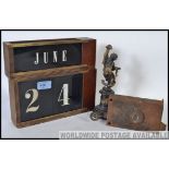 A collection of vintage date cards from a wooden desk clock together with a vintage 19th century