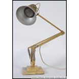 A vintage original Herbert Terry angle poise lamp with a two step base.