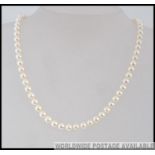 A ladies pearl necklace choker with 18ct gold clasp. Total weight 24.