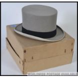Moss Bros. Gents top hat in original box. To fit head size 7 1/4.