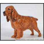 A royal Doulton figure of a Cocker Spaniel ' Lucky pride of ware ' HN1186 issued in 1937 and