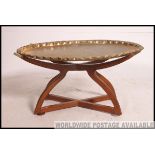 A contemporary good quality brass and mahogany side table.