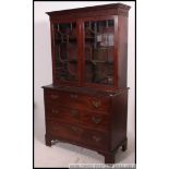 An 18th century Georgian mahogany bookcase on chest of drawers.