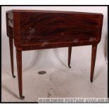 A early 19th century Georgian flame mahogany inlaid Pembroke table,