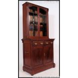 A Victorian style mahogany library boookcase cupboard.