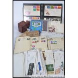 A collection of three stamp albums with stamps from around the world, Cigarette card albums,