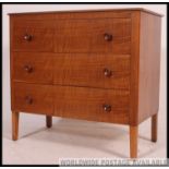 An original Gordon Russell walnut chest of drawers and matching bedside cabinet.