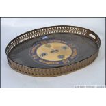 A good quality brass 20th century oval butlers tray with armorial painted coat of arms.