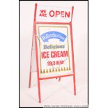 A retro late 20th century point of sale A-board advertising sign for Pollards Ice cream below a