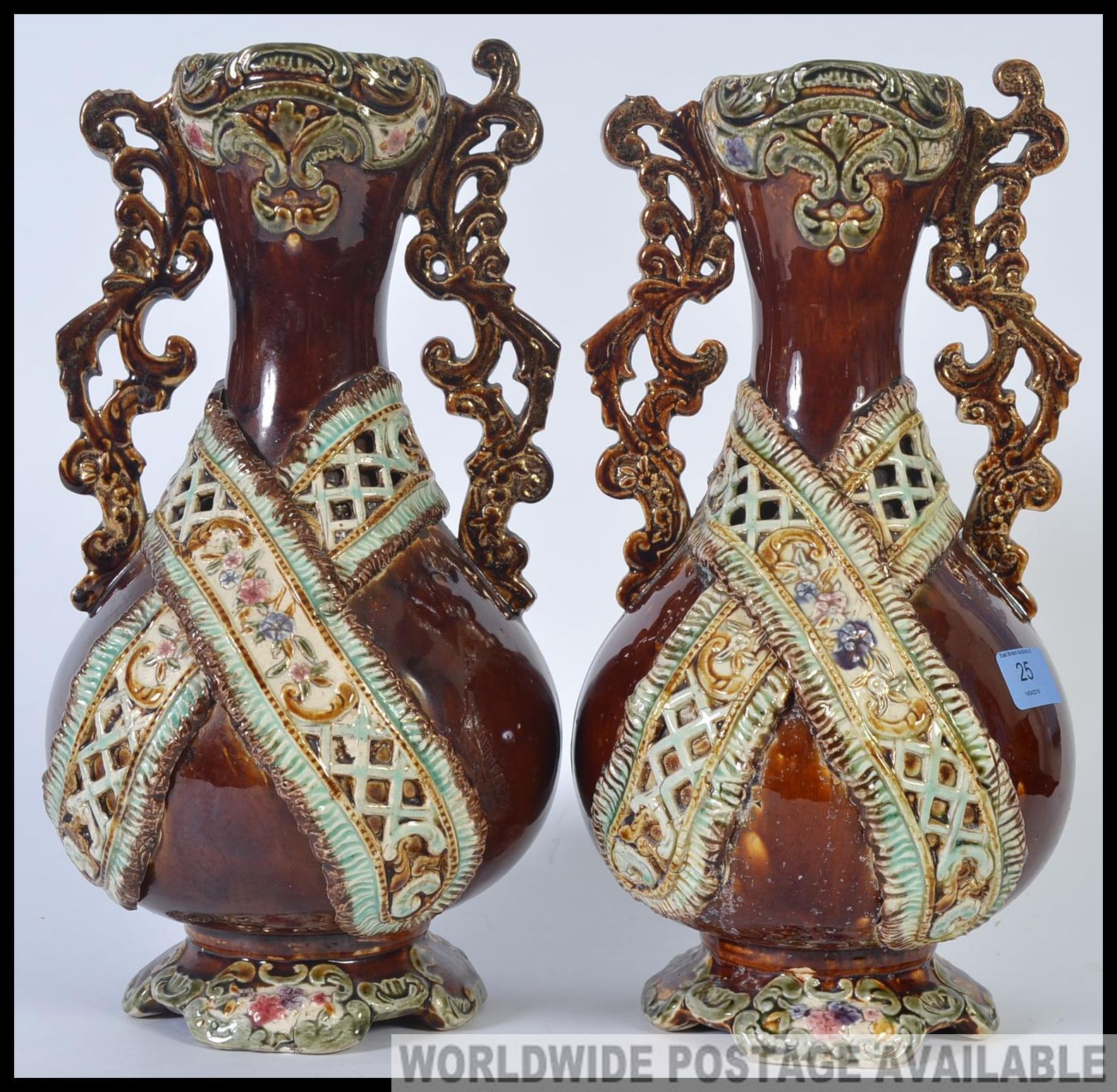 A pair of 19th century bargeware style Majolica vases being stone glazed with embellishments H37cm