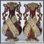 A pair of 19th century bargeware style Majolica vases being stone glazed with embellishments H37cm