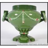 An early 20th century Austrian eichwald secessionist vase having green glaze with embellishments