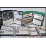 Four albums of assorted First Day Covers - to include various examples, commemorative coin editions,