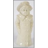 A 19th Century Royal Worcester Kate Greenaway candle snuffer " Boy with hands in pocket " bearing