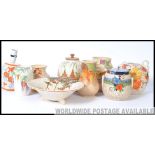 A large collection of assorted vintage Art Deco Bewley ceramics / pieces to include pots, vases etc.