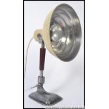 A vintage Pifco heat lamp, later converted into a lamp, standing on a shaped base.