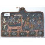 A tribal painting on wood of earthy pigments having tribal figures in a Sudan chair being fanned by