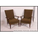 2 vintage Parker Knoll armchairs of Danish influence having angular show wood frames with