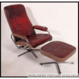 A retro 1980's ox - blood leather and chromed tubular metal reclining swivel armchair and