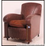 A charming 1920's / 1930's Art Deco childs leather armchair.