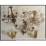 A collection of brass and cut glass chandeliers together with gilt rococo and glass sconce wall