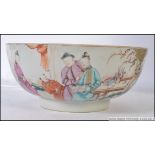 A 19th century Chinese famille rose large bowl raised on inset circular step plinth,