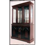 A Regency mahogany sideboard / bookcase dresser comprising a series of cupboards ,