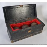 A set of 18th century treen bowling balls complete in a velvet lined pine box.