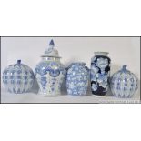 A pair of 20th century Chinese blue and white ginger jars of pumpkin form complete with lids.